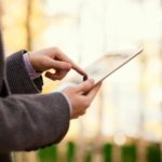 Man Looking At Tablet - iStock