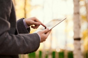 Man Looking At Tablet - iStock