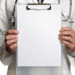 Dr with clip board - iStock